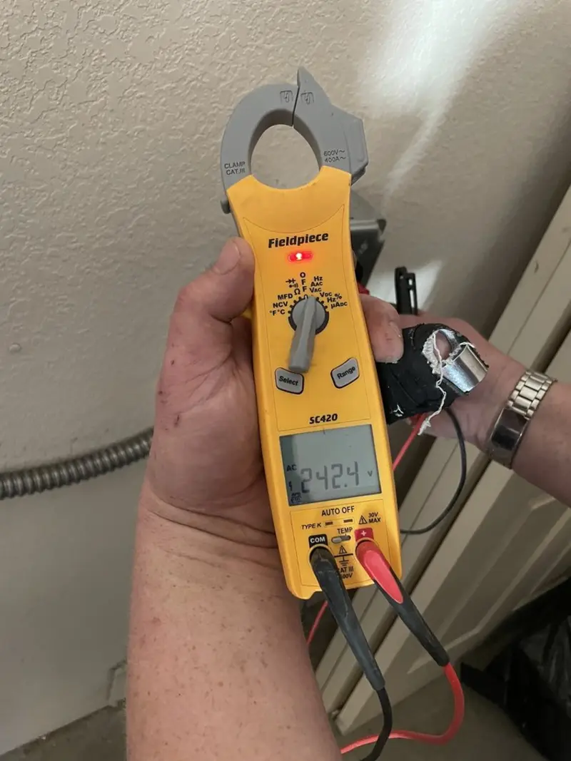 Voltage testing with clamp meter during Outlet Installation in New Windsor